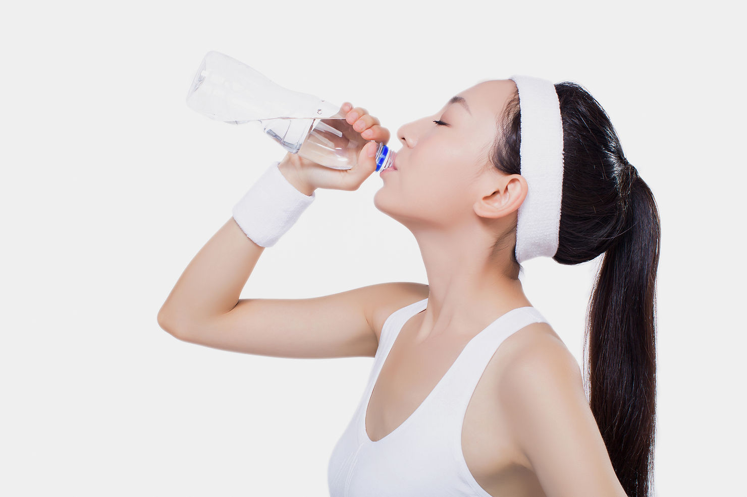 Woman hydrating drinking water